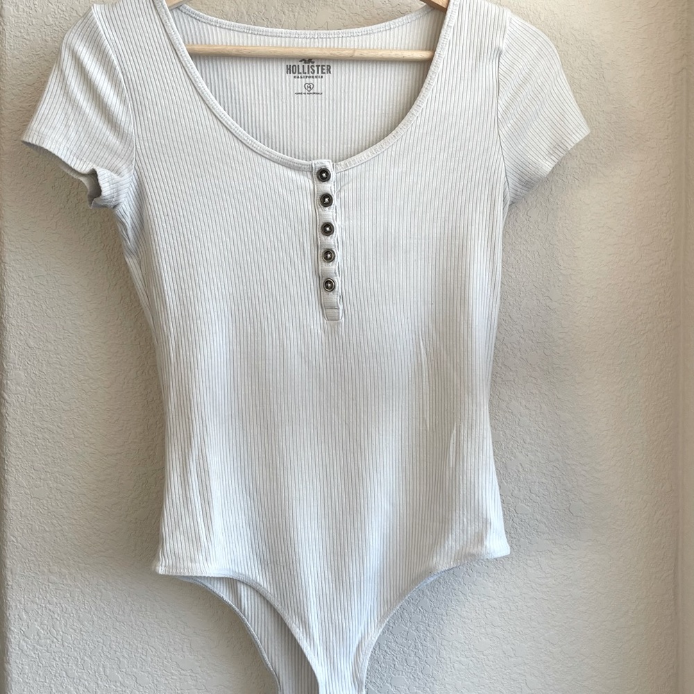 White buttoned thong body suit